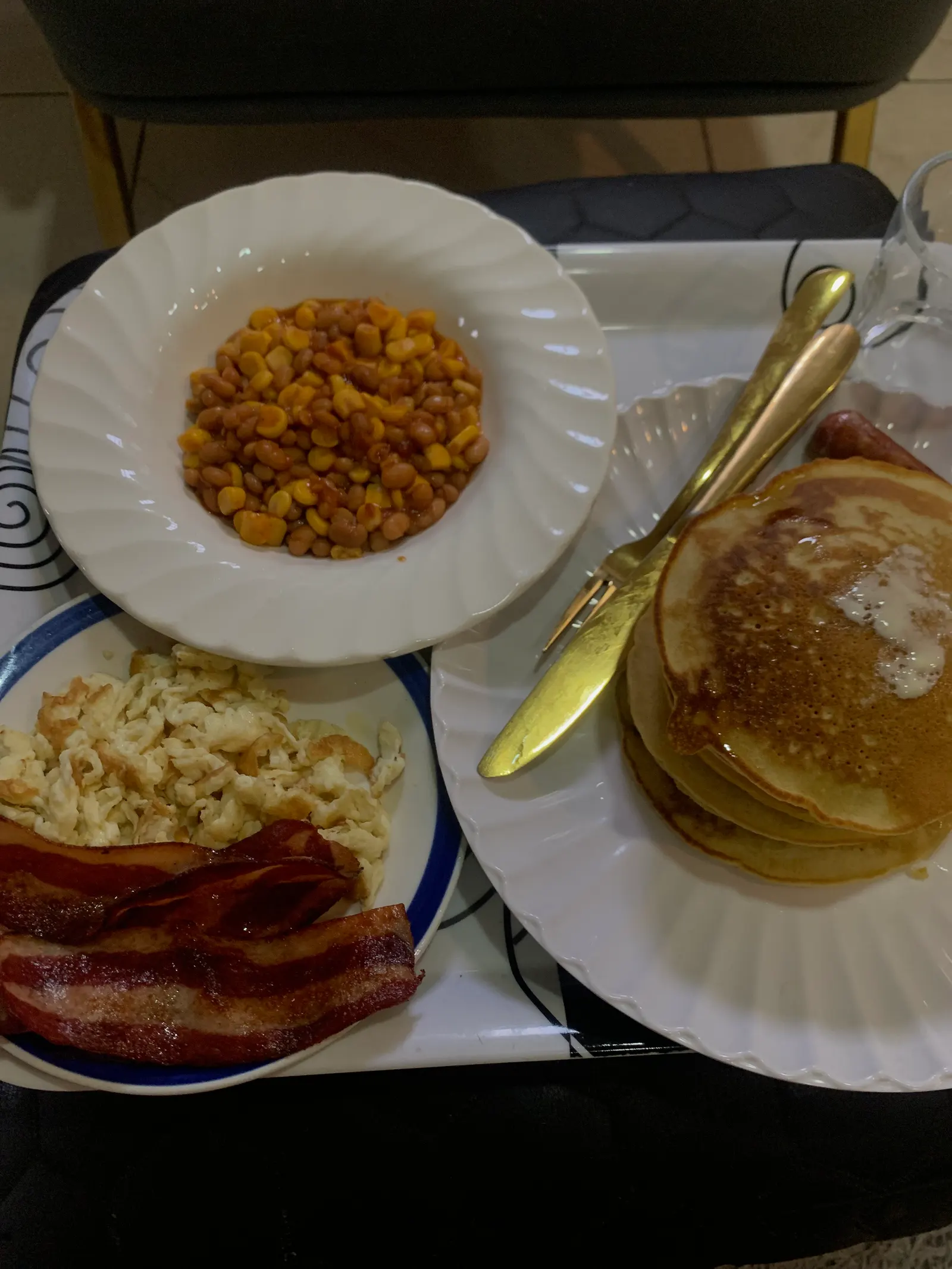 English breakfast, pancakes scrambled eggs , baked Beans and sweet corn , bacon and sausage