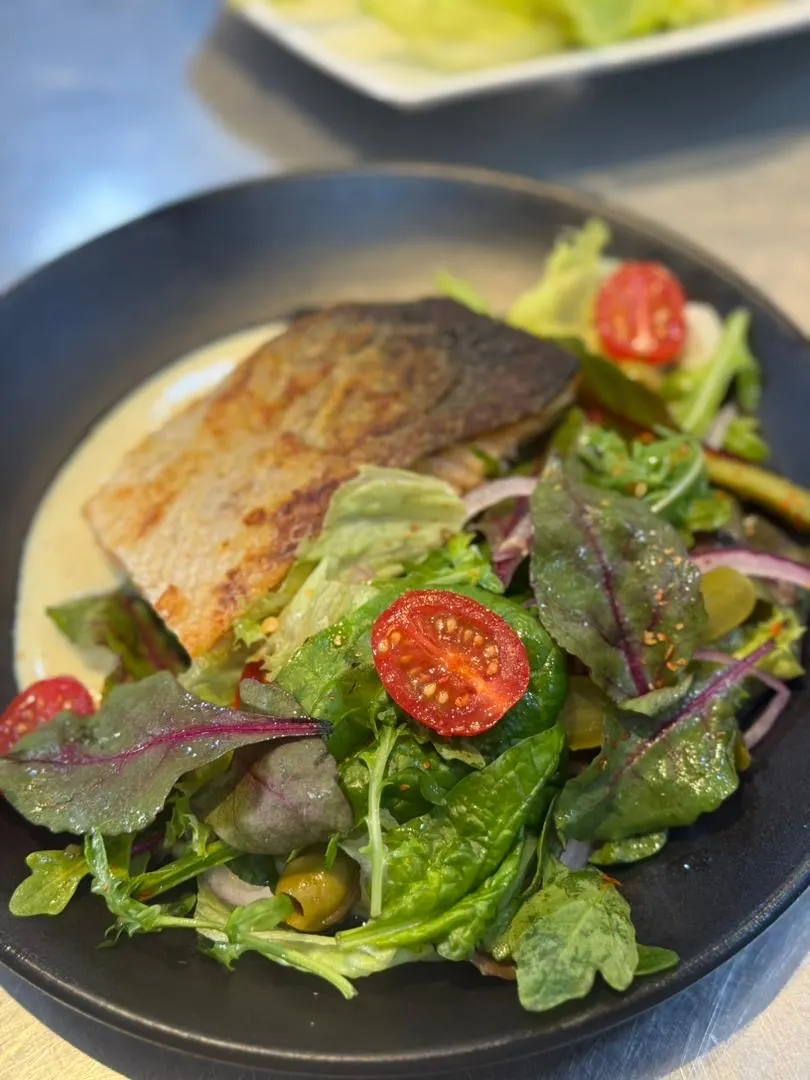 Mixed green salad with salmon